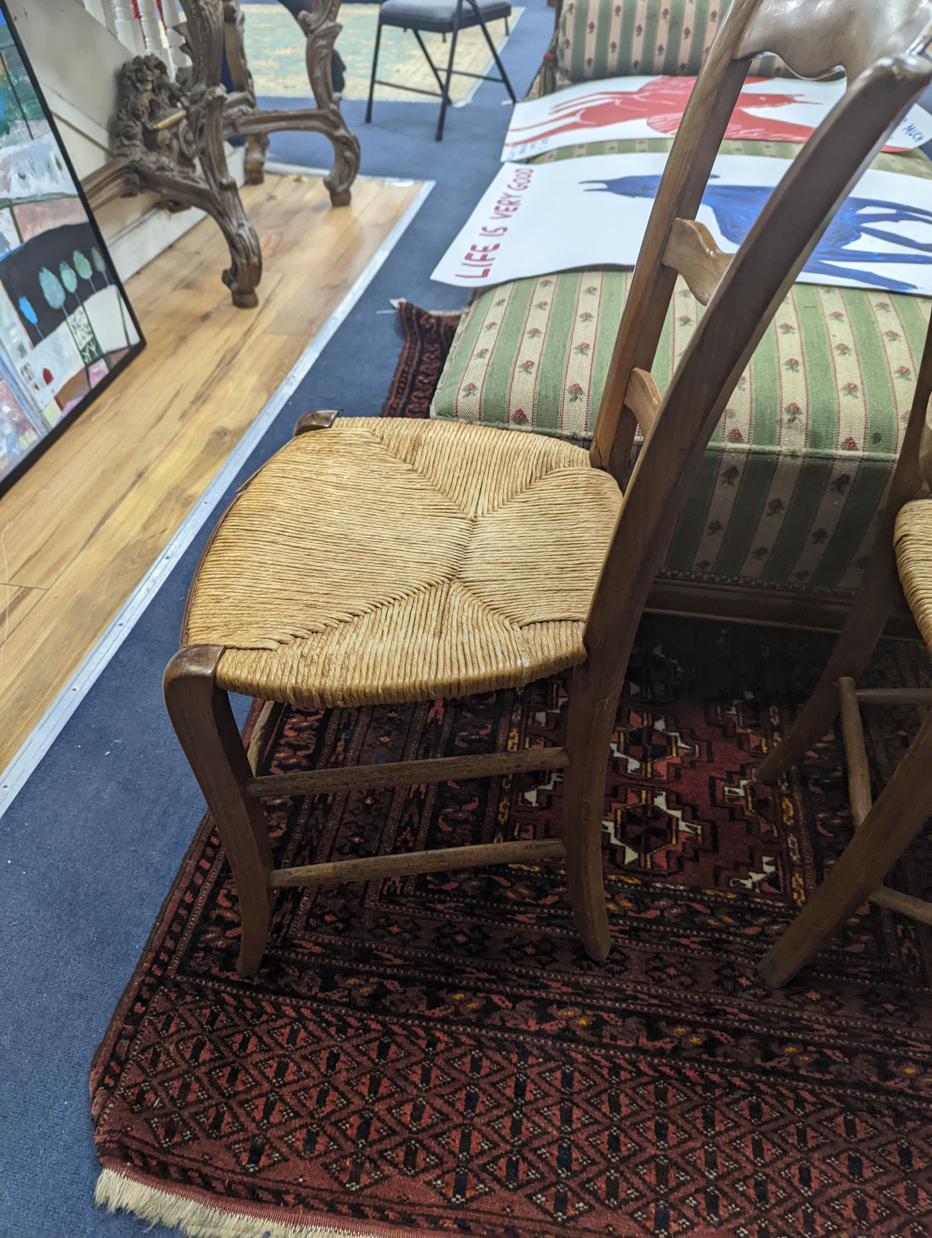 A pair of 19th century French rush seat walnut dining chairs